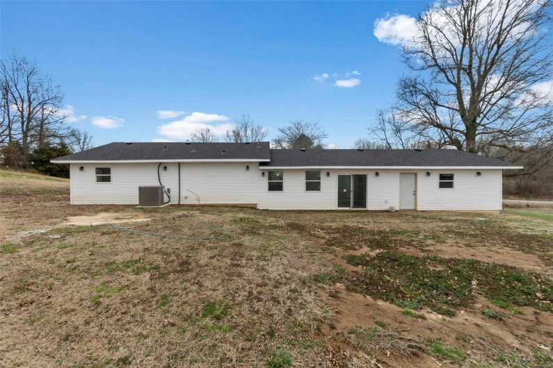 Back of property with central AC unit
