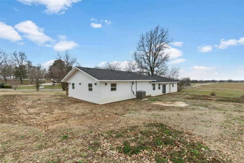 Rear view of property featuring cooling unit
