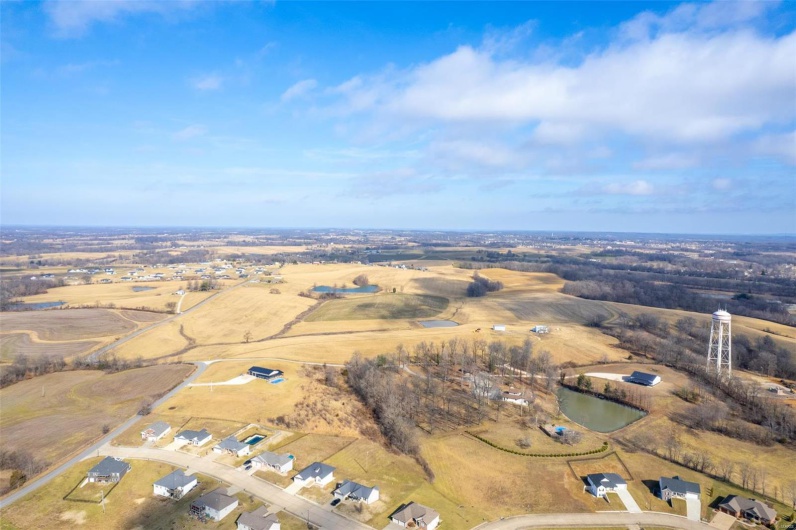 Bird's eye view with a water view and a rural view