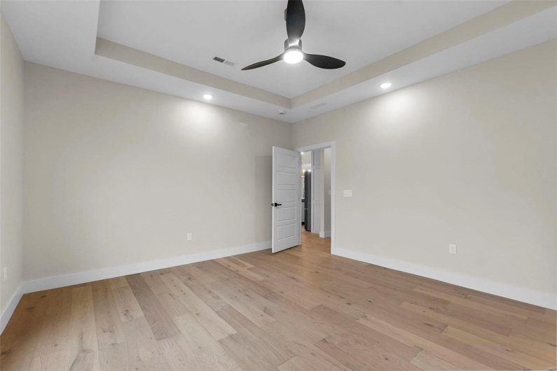 Spare room featuring ceiling fan and light hardwood / wood-style flooring