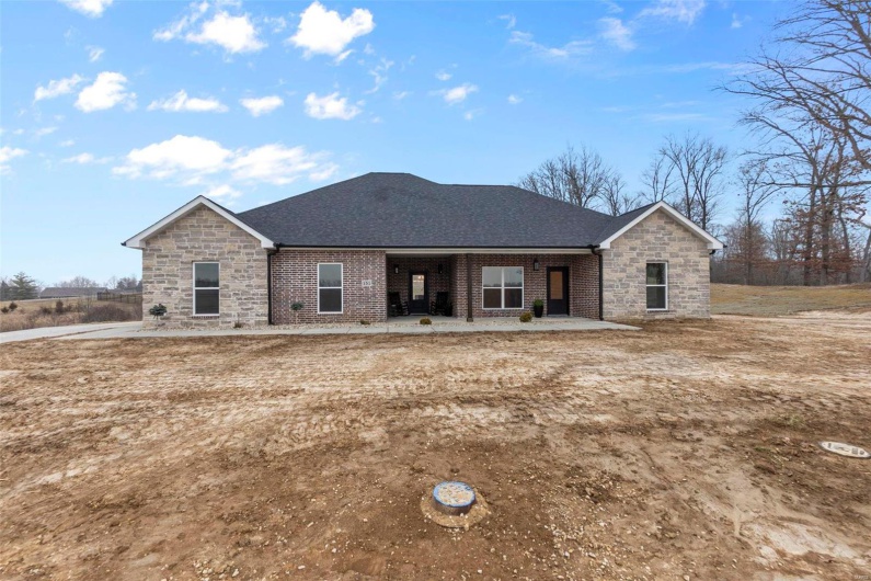 View of front of property featuring a patio area