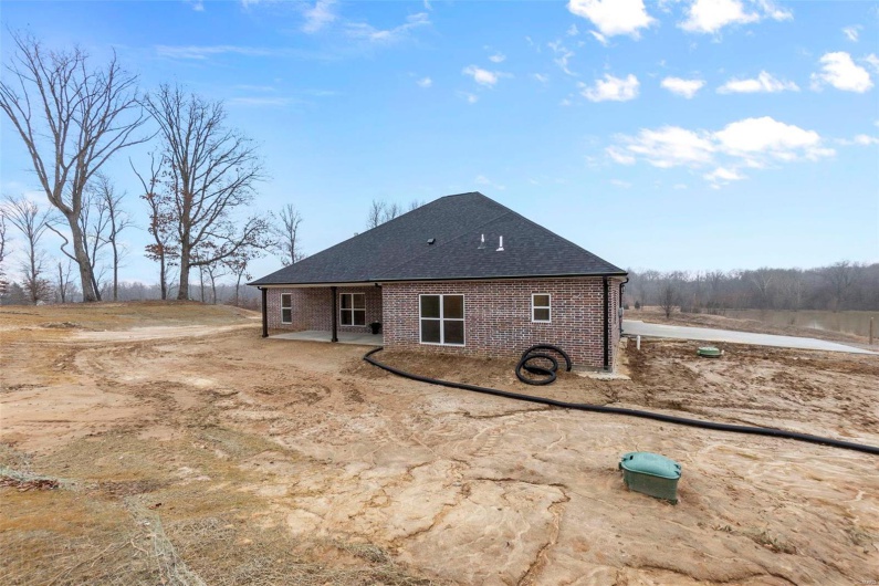 Back of house with a patio area