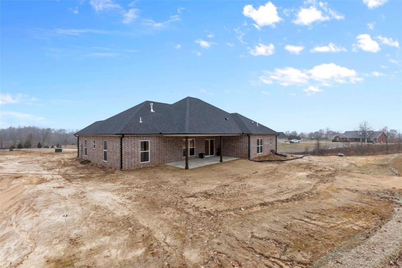 Rear view of property featuring a patio