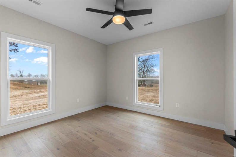 Unfurnished room featuring light hardwood / wood-style floors and ceiling fan