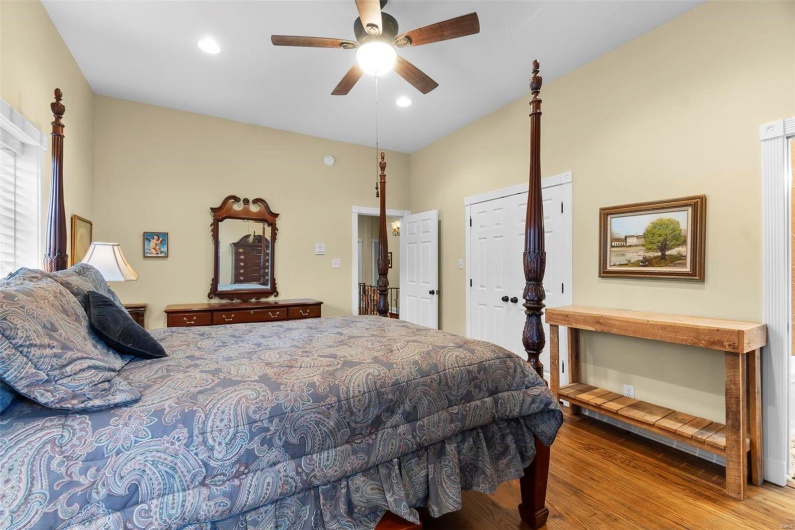 Bedroom featuring light hardwood / wood-style flooring and ceiling fan