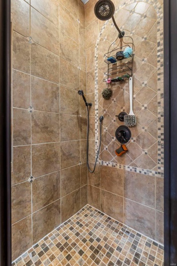 Bathroom featuring a tile shower