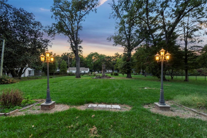 View of property's community with a yard