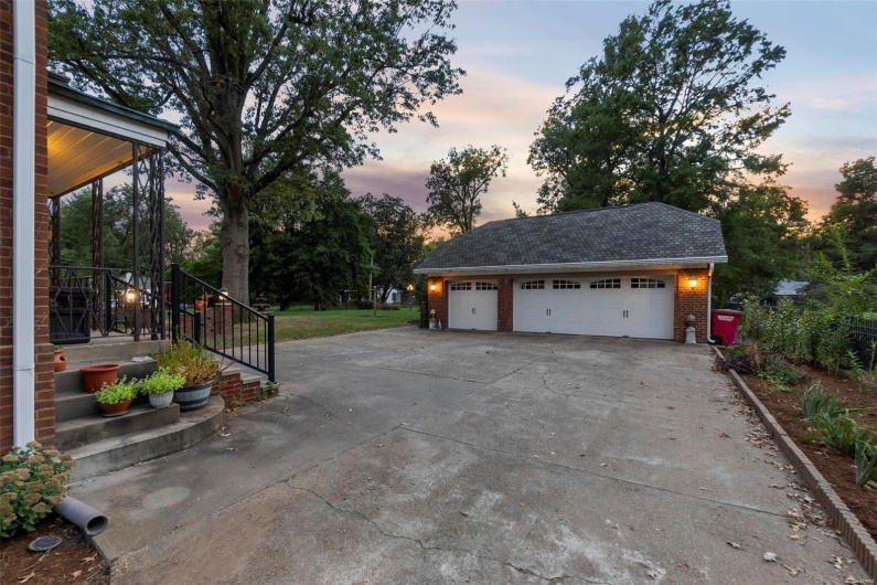 View of garage at dusk