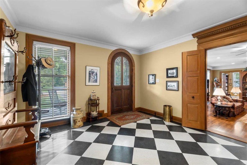 Entrance foyer featuring ornamental molding