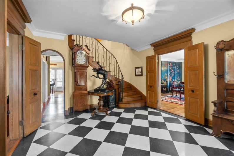Foyer entrance featuring ornamental molding