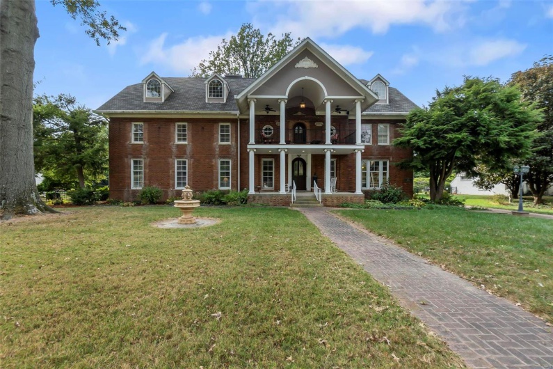 View of front of property with a front yard