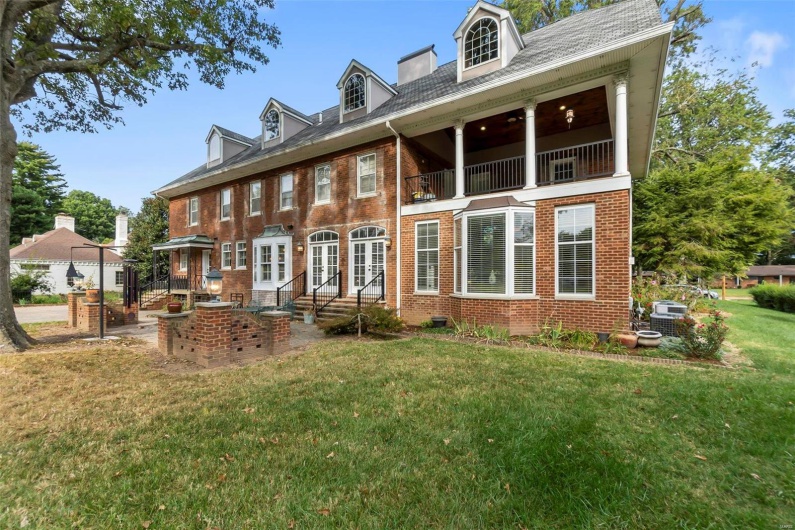 Rear view of house with a yard