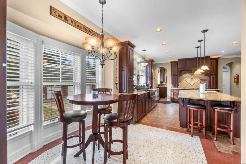 Dining space featuring an inviting chandelier and crown molding