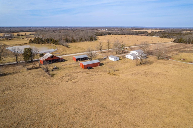 Bird's eye view with a water view and a rural view