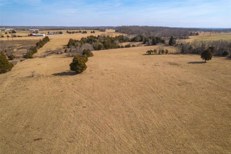 Birds eye view of property featuring a rural view