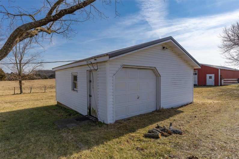 Garage featuring a yard