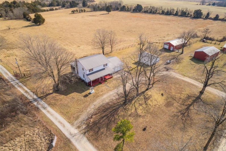 Birds eye view of property featuring a rural view