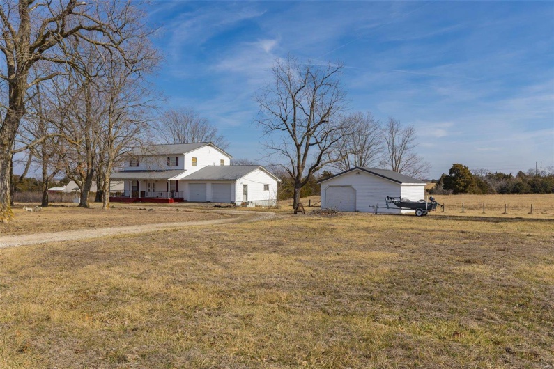View of yard featuring covered porch