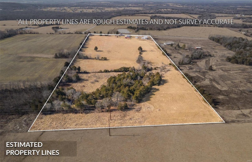 Birds eye view of property featuring a rural view