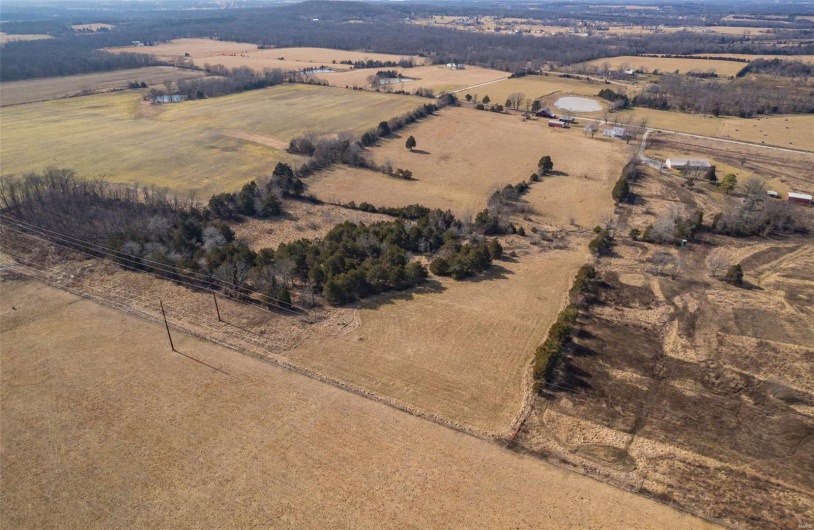 Birds eye view of property with a rural view