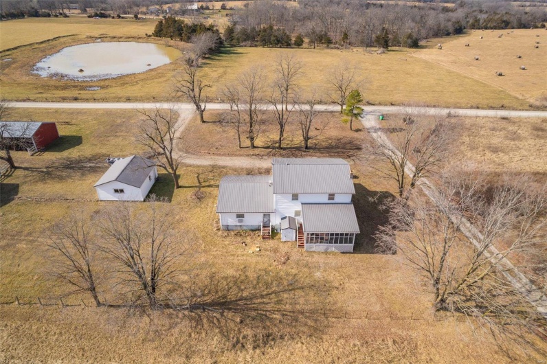 Birds eye view of property with a rural view