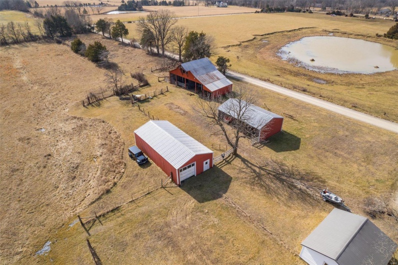 Drone / aerial view with a water view and a rural view