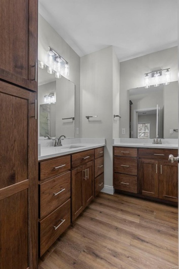 Bathroom featuring vanity and wood-type flooring