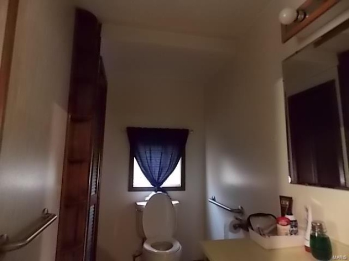 Bathroom with vanity and toilet