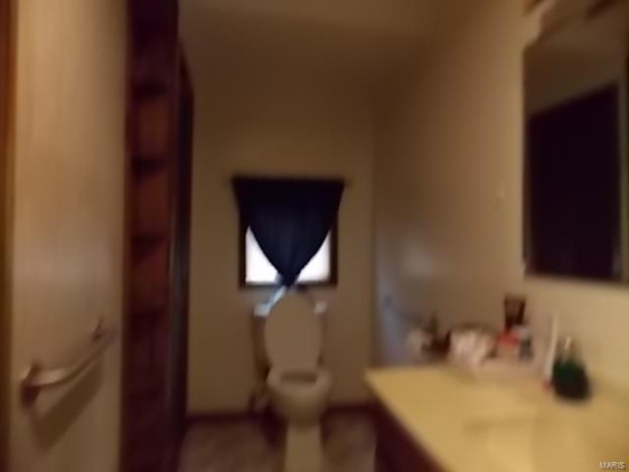 Bathroom with vanity and toilet