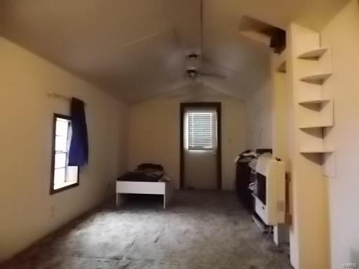 Bonus room featuring heating unit and vaulted ceiling