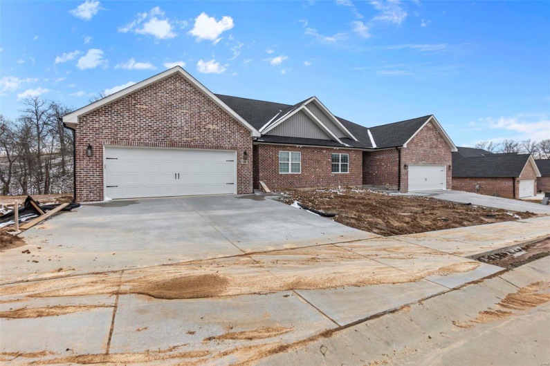 View of front facade featuring a garage