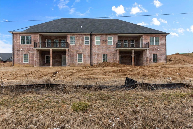 Back of house featuring a balcony