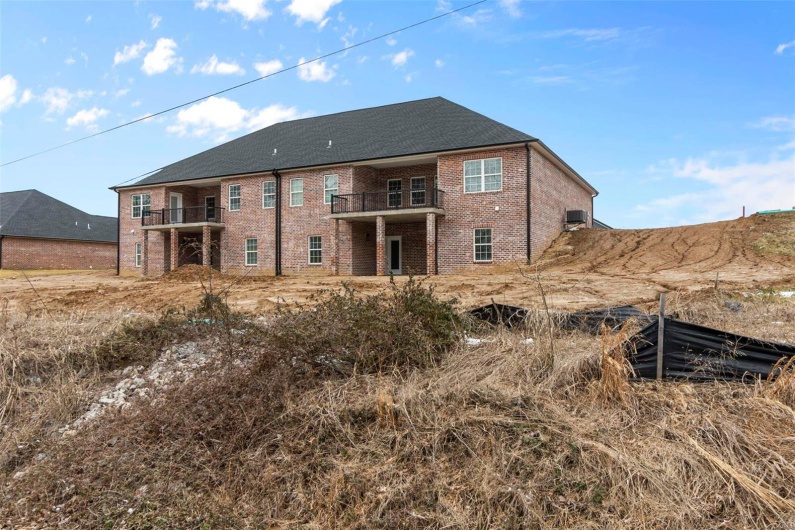 Rear view of property with a balcony