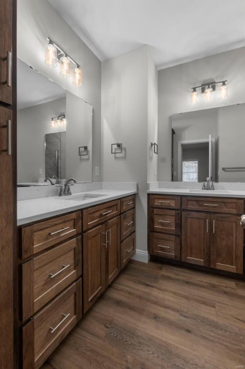Bathroom with hardwood / wood-style floors and vanity