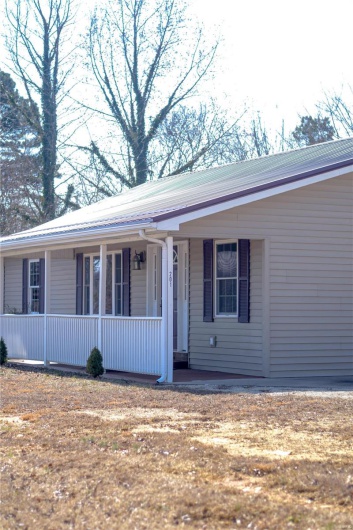 View of front of property featuring covered porch