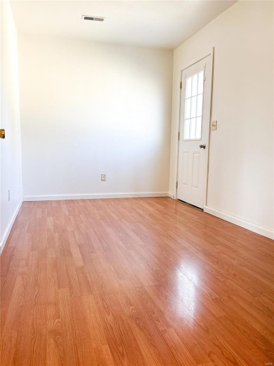 Unfurnished room featuring light wood-style flooring and baseboards