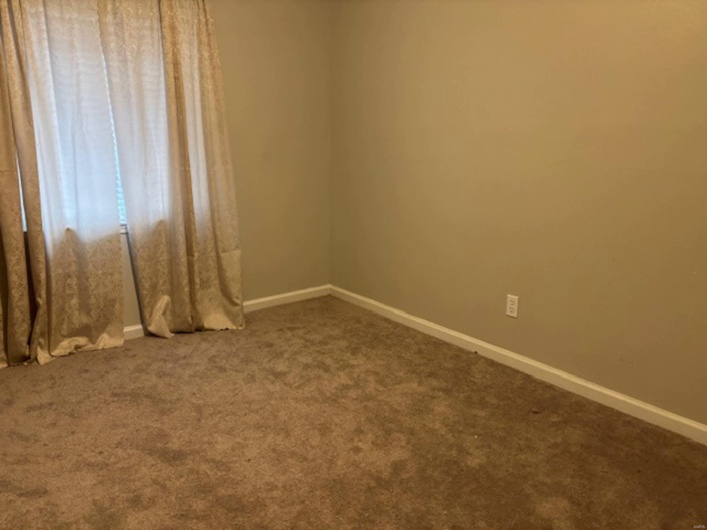 View of carpeted spare room