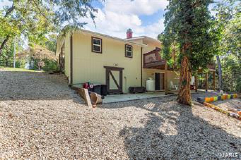 Rear view of house with a patio