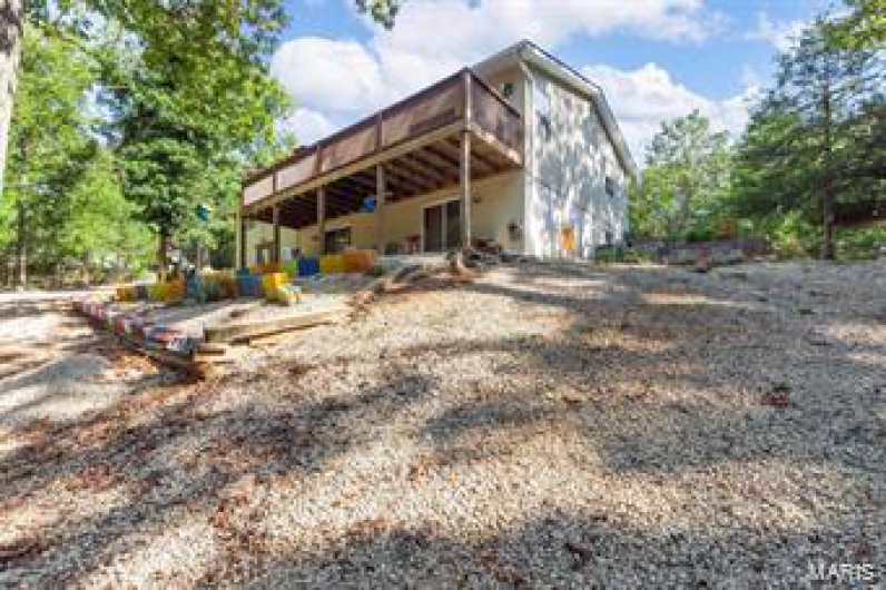 Back of property featuring a deck