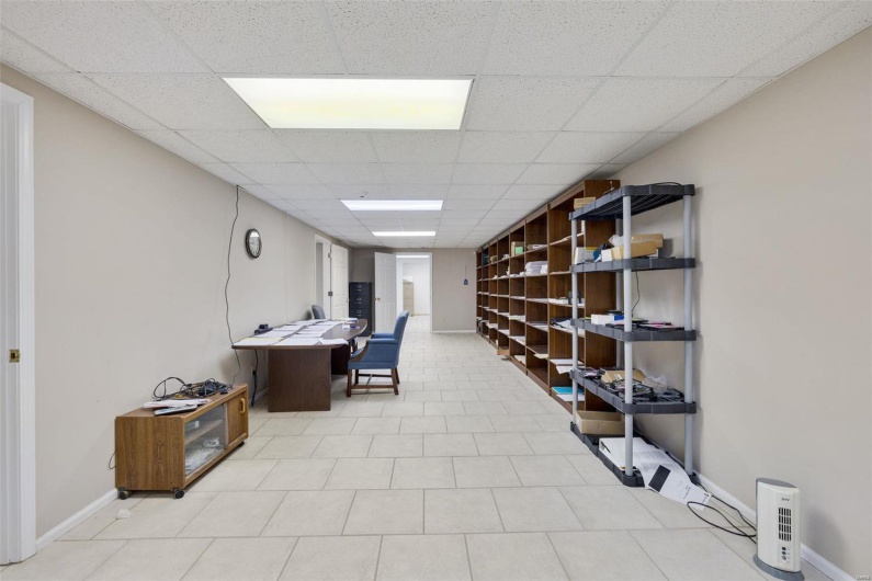 Office with a paneled ceiling