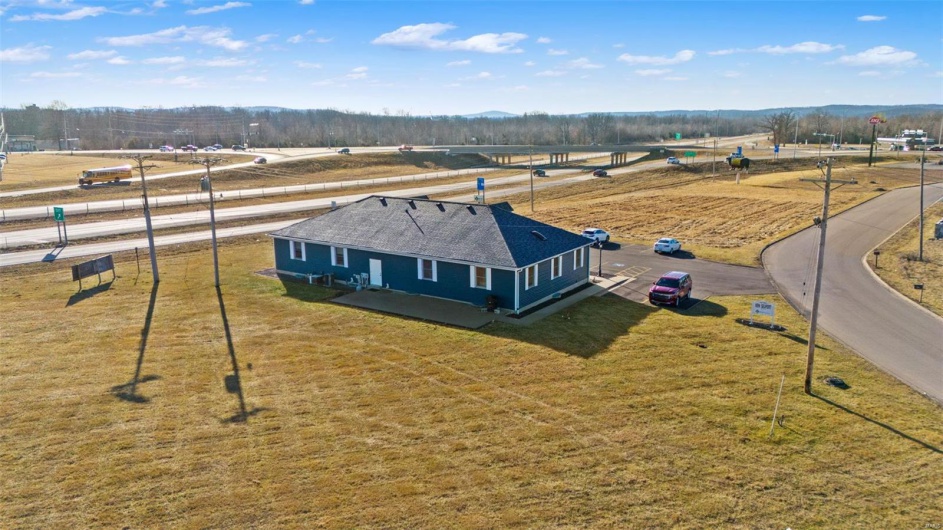 Birds eye view of property featuring a rural view