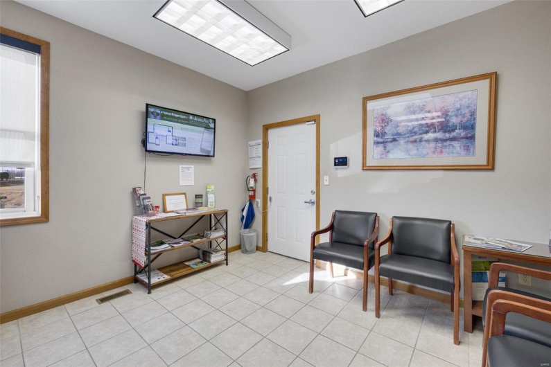 Living area with light tile patterned floors