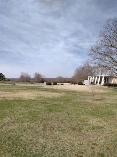 View of yard with a rural view