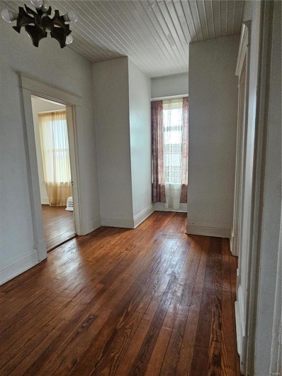 Spare room with hardwood / wood-style floors and wooden ceiling
