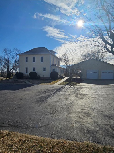 View of side of home with a garage