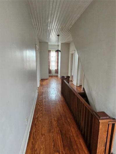Hall featuring hardwood / wood-style flooring and wood ceiling