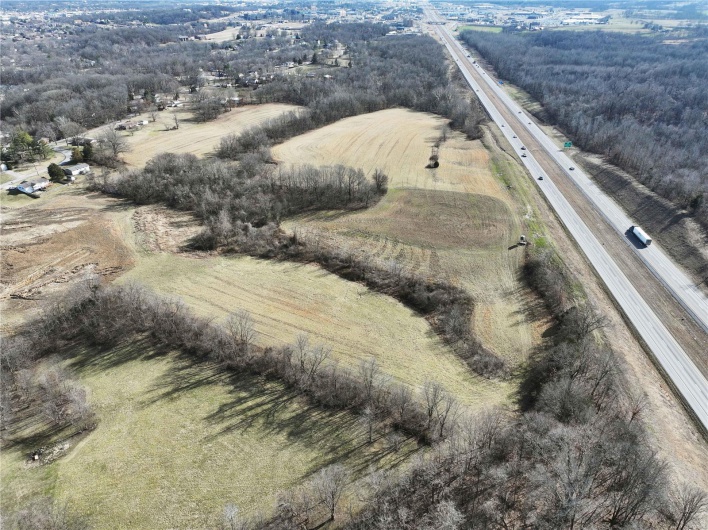 Birds eye view of property with a rural view