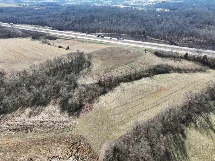 Birds eye view of property with a rural view