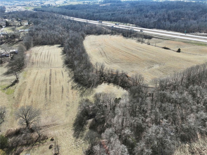 Birds eye view of property with a rural view