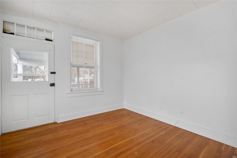 Second floor apartment. Entryway featuring hardwood / wood-style floors.